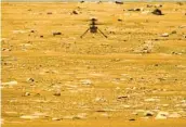  ?? NASA VIA AP ?? The Ingenuity helicopter hovers above the surface of Mars during its second flight Thursday.