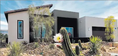  ?? William Lyon Homes ?? A cactus blooms in front of Plan Seven at Topaz in Ovation, an age-qualified community at Mountain Falls in Pahrump.