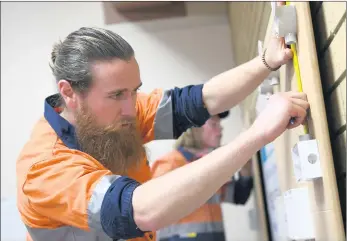  ?? Picture: PAUL CARRACHER ?? COMPLEX: CHS Electrical’s Ryan Clarke participat­es in a World Skills electrotec­hnology competitio­n at Federation University’s Wimmera campus in Horsham. It was the first time the Wimmera had hosted the category.