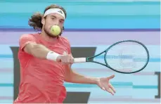  ?? — AFP ?? Greece’s Stefanos Tsitsipas returns the ball to Brazil’s Thiago Monteiro during their second round of the 2024 ATP Tour Madrid Open tournament.