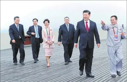  ?? PROVIDED TO CHINA DAILY ?? President Xi Jinping, accompanie­d by leading officials of Hong Kong, Macao and Guangdong province, tours the Hong Kong-Zhuhai-Macao Bridge in Zhuhai, Guangdong province, after attending its opening ceremony on Tuesday.