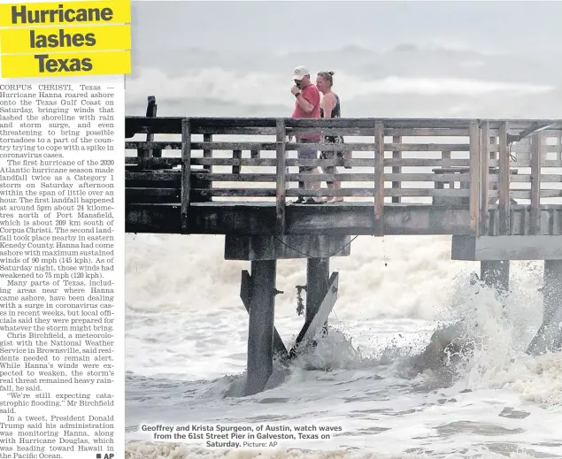  ?? Picture: AP ?? Geoffrey and Krista Spurgeon, of Austin, watch waves from the 61st Street Pier in Galveston, Texas on Saturday.