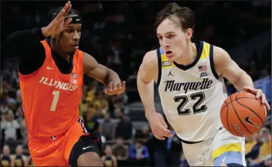  ?? (AP/Aaron Gash) ?? Marquette’s Tyler Kolek (right) drives to the basket against Trent Frazier of Illinois during the first half Monday in Milwaukee. Kolek converted a steal into a go-ahead layup with 18 seconds left to help lead Marquette to a 67-66 comeback victory.