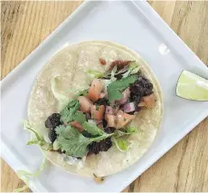  ??  ?? The Carne Asada Street Taco is one of several Taps & Tacos offerings that resulted from the experiment­ation of head chef Jeffrey Fagan.