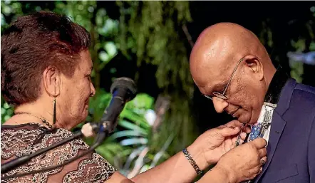  ??  ?? New mayor K Gurunathan receives his mayoral chains from Te Atiawa kuia June Davies.