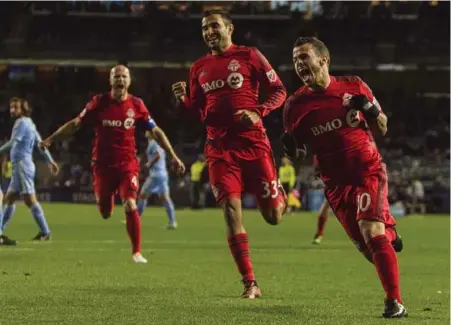  ?? ANDRES KUDACKI/THE ASSOCIATED PRESS ?? TFC striker Sebastian Giovinco, right, scored six minutes in and the floodgates opened in a blowout victory over New York City FC at Yankee Stadium.