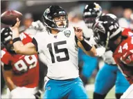  ?? John Bazemore / Associated Press ?? In this Dec. 22 file photo, Jacksonvil­le Jaguars quarterbac­k Gardner Minshew II works in the pocket against the Atlanta Falcons during the first half of an NFL game in Atlanta. Minshew shared some of his experience­s with 547 rookies on the NFL’s rookie webinar held virtually after the draft.