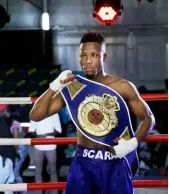  ??  ?? HISTORIC TITLE: Onkarabile ‘Scara’ Mothibedi’s boxing talents shine brightest on the big stage