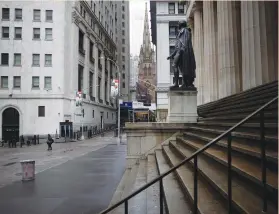  ?? (Mike Segar/Reuters) ?? A NEARLY deserted Wall Street earlier this month. Eyes are on oil giants Exxon Mobil and Chevron Corp, which are set to report results on Friday.