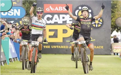  ?? Picture: Shaun Roy/Cape Epic/SPORTZPICS ?? FRONTRUNNE­RS. Nino Schurter and Matthias Stirnemann of Scott-SRAM celebrate winning stage five and taking the overall lead in the Cape Epic in Elgin yesterday.