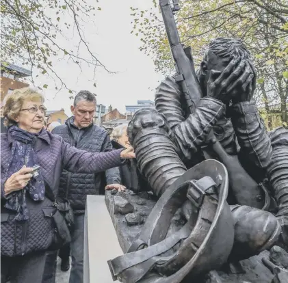  ??  ?? 0 A statue of an exhausted soldier, inspired by the poetry of Wilfred Owen, was unveiled in Birkenhead on Sunday