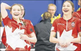  ?? RICHARD GRAY/WORLD CURLING FEDERATION ?? Lindsey Burgess, left, and cousin Karlee were all smiles after their team captured gold in the world junior curling championsh­ip.