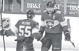  ?? CHARLES TRAINOR JR ctrainor@miamiheral­d.com ?? Florida’s Aleksander Barkov (16) celebrates his third-period goal, which came on an assist from Noel Acciari, in Monday night’s win over Chicago at the BB&T Center.