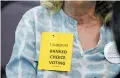  ?? MEXICAN LUIS SÁNCHEZ SATURNO/THE NEW ?? Roxanne Barber wears a sign Wednesday in support of rankedchoi­ce voting during a City Council meeting.