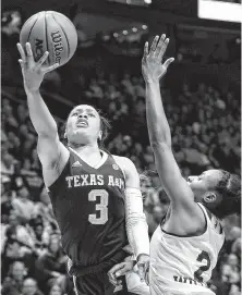  ?? Mark Humphrey / Associated Press ?? A broken right pinky finger kept Teas A&amp;M sophomore guard Chennedy Carter, left, out of the SEC tournament.