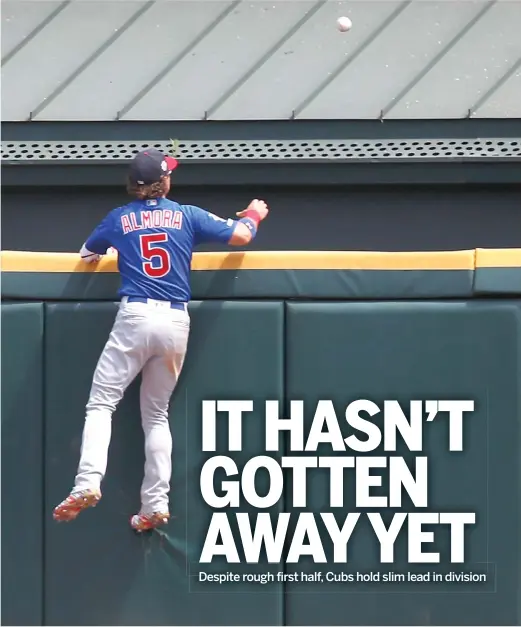  ?? JIM YOUNG/AP ?? Albert Almora leaps against the wall but can’t make the catch on Eloy Jimenez’s two-run homer in the fourth inning Sunday at Guaranteed Rate Field.