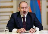  ?? (AP/PAN photo/Tigran Mehrabyan, Armenian Prime Minister Press Service) ?? Armenian Prime Minister Nikol Pashinian addresses the nation
Saturday in Yerevan, Armenia.