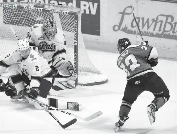  ?? Regina Leader-Post photos by Michael Bell ?? Lethbridge Hurricanes forward Egor Babenko (22) scores over the shoulder of Regina Pats goalie Tyler Brown during WHL Eastern Conference final playoff action at the Brandt Centre on Friday.