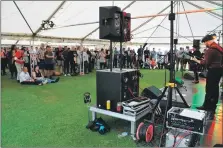  ??  ?? A big crowd at the festival held last July on Lamlash Green.