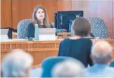  ?? EDDIE MOORE/JOURNAL ?? Secretary of State Maggie Toulouse Oliver listens to Viki Harrison, executive director of Common Cause New Mexico, in a hearing Thursday in Santa Fe on proposed campaign spending rules.