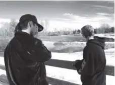 ?? RJ Sangosti, The Denver Post; Kenneth D. Lyons, The Denver Post ?? Right: Conner Tasei, 16, left, and John Schamp, 18, both students at Legend High School, know all three boys who fell into the icy pond.