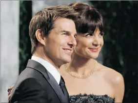  ?? Reuters ?? Tom Cruise and Katie Holmes, seen in West Hollywood, Calif., on Feb. 26,
settled their divorce on Monday.