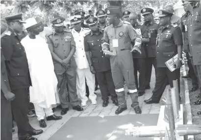  ?? Pic Shehu K. Goro ?? From left: Chief of Air Staff, Air Marshal Sadiq Baba Abubakar; Deputy Governor of Kaduna State, Arch. Yusuf Barnabas Bala Bantex and Chief of Defense Staff, General Gabriel Olonishaki­n, inspect equipment during an exhibition at the Nigeria Air force...