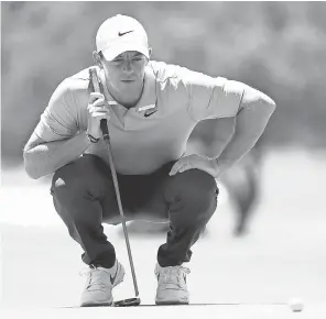  ?? RAYMOND CARLIN III/ USA TODAY SPORTS ?? Rory McIlroy lines up his putt on the second green Sunday in the Charles Schwab Challenge, where he finished tied for 32nd.