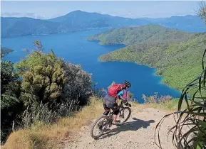  ?? BENNETTAND­SLATER.CO.NZ ?? Ridgeline riding on Queen Charlotte Track, with epic views of the Marlboroug­h Sounds.