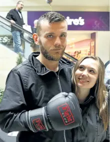  ?? CLIFFORD SKARSTEDT/EXAMINER ?? Boxer Andrew Slade with cousin Jessica Matser at Lansdowne Place centre court on Saturday. Slade makes his pro debut at Saturday’s Homecoming: The Return of Cody Crowley boxing card at the Memorial Centre.
