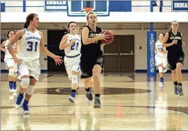  ?? Photos by TIM GODBEE / For the Calhoun Times ?? ( ( ABOVE) Calhoun’s Jana Johns (center) breaks away for a lay-up on Thursday. BELOW) Calhoun’s Cassie Henderson drives the lane between defenders.