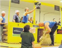  ?? PHOTO: SALLY BROOKER ?? Here you go . . . Jack Fagan switches on the shearing machine for his father, Sir David Fagan, halfway through the Waimate Shears ‘‘father and son’’ event.