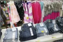  ?? MARK LENNIHAN — THE ASSOCIATED PRESS ?? Cat & Jack jeans, foreground, appear on display at a Target store in New York.