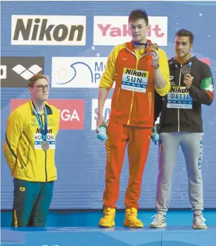  ??  ?? Australian swimmer Mack Horton (left) refuses to share the podium with Chinese gold medallist Sun Yang at the 2019 FINA World Championsh­ips last month.