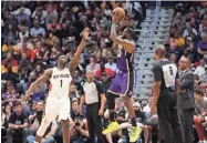  ?? DERICK E. HINGLE/USA TODAY SPORTS ?? Lakers forward LeBron James (23) shoots over Pelicans forward Zion Williamson (1) Sunday at the Smoothie King Center.