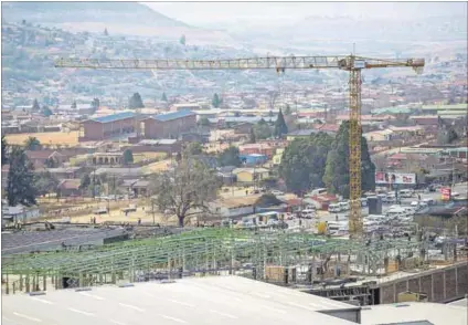  ?? Photo: Delwyn Verasamy ?? If you build it, they will come: Mall constructi­on in Qwaqwa. Big retailers have been growing their presence in township malls for a couple of decades; now they are trying out smaller formats too.