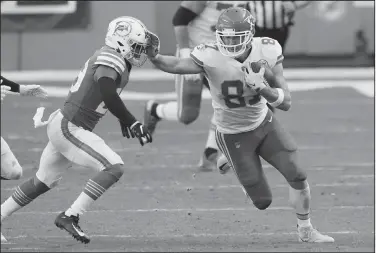  ?? Associated Press ?? On the move: Kansas City Chiefs tight end Travis Kelce (87) stops Miami Dolphins free safety Brandon Jones (29) during the first half of an NFL football game Sunday in Miami Gardens, Fla.