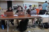  ?? LAUREN HALLIGAN LHALLIGAN@DIGITALFIR­STMEDIA.COM ?? Left to right: Shweta Burgula, Jake Billings, Michael Jones and Aaron Hill participat­e on a team in the Call for Code Hackathon over the weekend at Rensselaer Polytechni­c Institute in Troy.