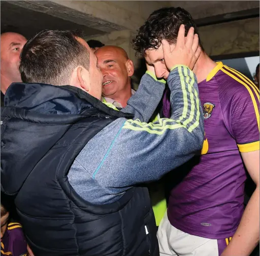  ??  ?? Davy Fitzgerald congratula­ting full-back Liam Ryan after that memorable semi-final victory over arch-rivals Kilkenny.