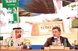  ?? AMER HILABI/AFP ?? Saudi Energy Minister Khaled al-Faleh (left) and Russian Energy Minister Alexander Novak attend a meeting of OPEC and non-OPEC members in Jeddah on April 20.