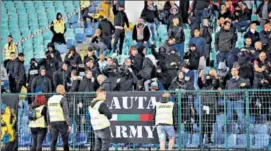  ??  ?? Bulgarian fans gesture as the Bulgaria vs England match was stopped twice due to racist chants.
AP