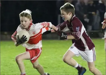  ??  ?? Patrick Rooney of Kilanerin on the move as Conn Mernagh (Piercestow­n) gives chase.