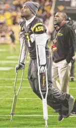  ?? CHERYL EVANS/ AZCENTRAL SPORTS ?? Arizona State senior RB Marion Grice was on crutches on the sideline Saturday during the game against Arizona. He suffered a lower-leg injury against UCLA and was listed as day to day all week. Coach Todd Graham has not tipped his hand yet about...