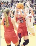  ?? Staff photograph by Mike Eckels ?? Junior Lady Blackhawks Ravin Cawthon (No. 10) and Blakelee Winn (No. 22) in the hardfought contest Friday, Feb. 14, in Gravette against the Lady Lions. Winn led all scorers with 17 points; Cawthon scored 4 points.