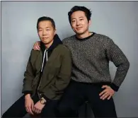  ?? (AP) ?? Director Lee Isaac Chung (left) and Steven Yeun pose for a portrait to promote the film “Minari” during the Sundance Film Festival on Jan. 27 in Park City, Utah.