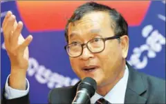  ?? TANG CHHIN SOTHY/AFP ?? Former opposition leader Sam Rainsy speaks to the media during a press conference in 2014 in Phnom Penh.