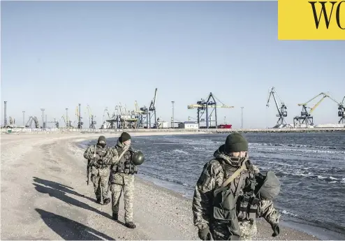  ?? MARTYN AIM / GETTY IMAGES ?? Soldiers with Ukraine’s border security force patrol the coast of the Azov Sea near the port of Mariupol on Thursday. U.S. President Donald Trump called off a meeting with Russian President Vladimir Putin at the G20 summit in Argentina because of Russia’s recent hostilitie­s with Ukraine.