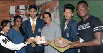  ??  ?? Effingham Secondary HOD in maths and physics Pavi Govindasam­y with matric pupils Bhenisha Ramcherith­a, Kiasha Pillay, Shaur Mahabeer, Abhay Jagdoe and Jonathan Banza in the school’s science class.