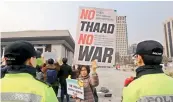  ?? AP ?? A protester holds up a banner during a rally demanding peace on the Korean Peninsula near US Embassy in Seoul, South Korea, on Monday. —