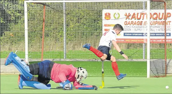  ??  ?? Ashford score one of their three goals against Old Wills on Saturday